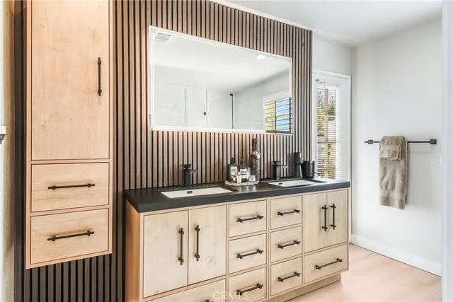 a kitchen with a sink and cabinets