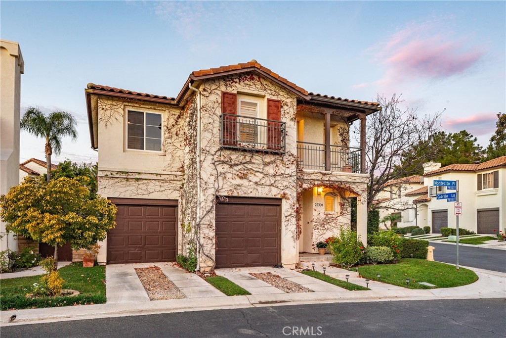 23301 Montecito Place Valencia, CA 91354 - Photo 2 of 41 a front view of a house with yard