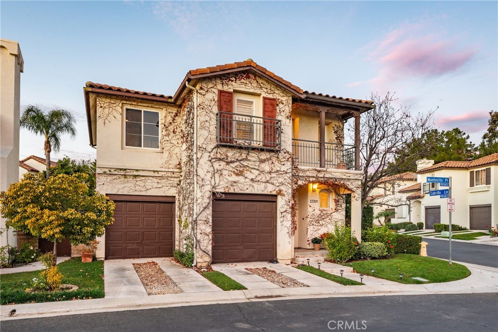 23301 Montecito Place Valencia, CA 91354 - Photo 2 of 41 a front view of a house with yard