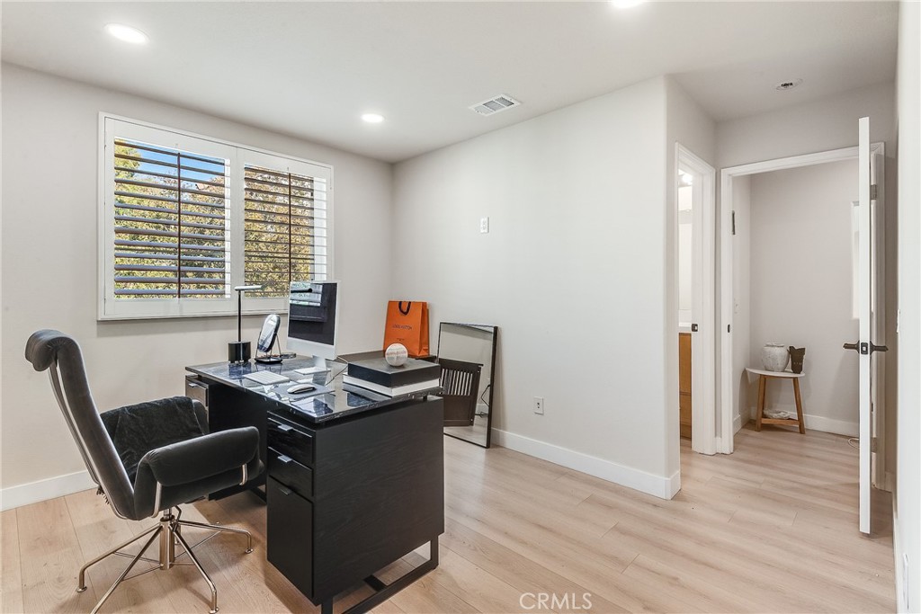 23301 Montecito Place Valencia, CA 91354 - Photo 26 of 41 a view of a workspace with furniture and a window