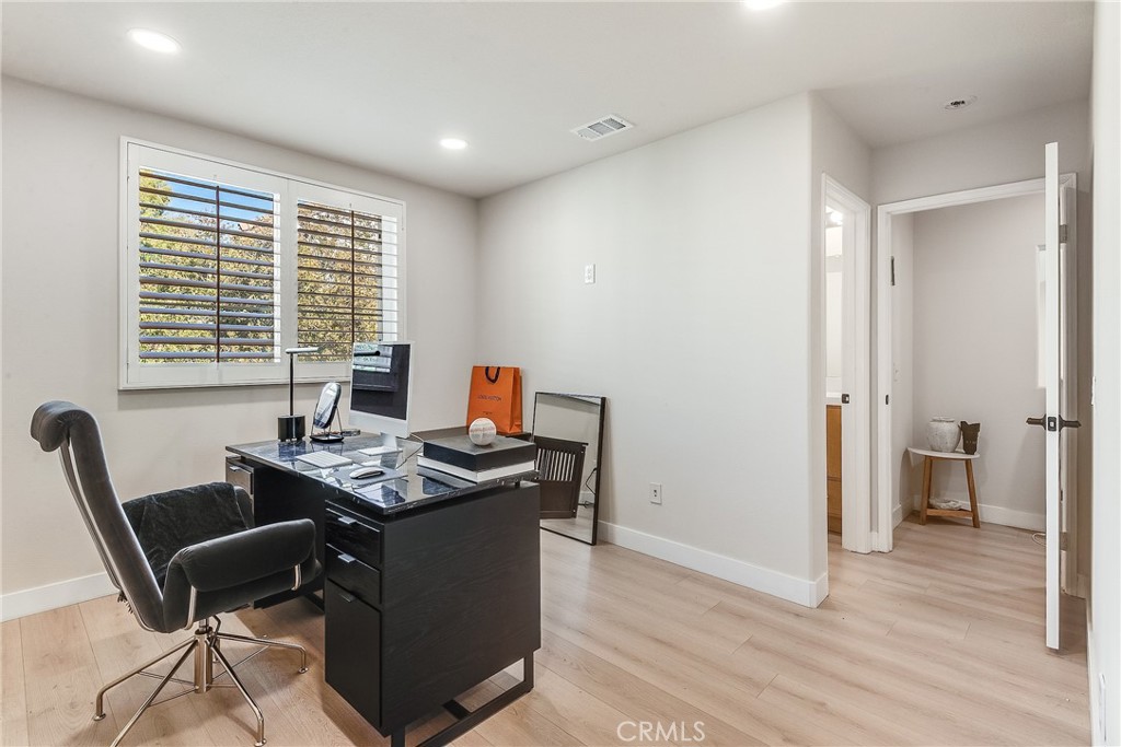 23301 Montecito Place Valencia, CA 91354 - Photo 26 of 41 a view of a workspace with furniture and a window
