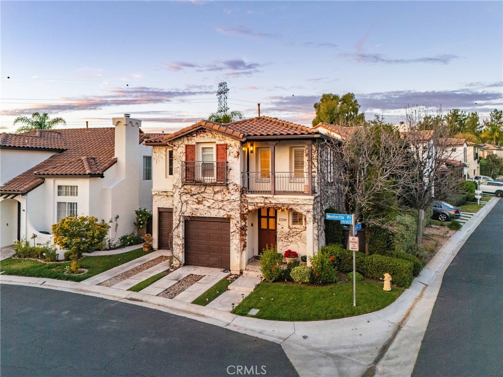23301 Montecito Place Valencia, CA 91354 - Photo 34 of 41 a front view of a house with garden