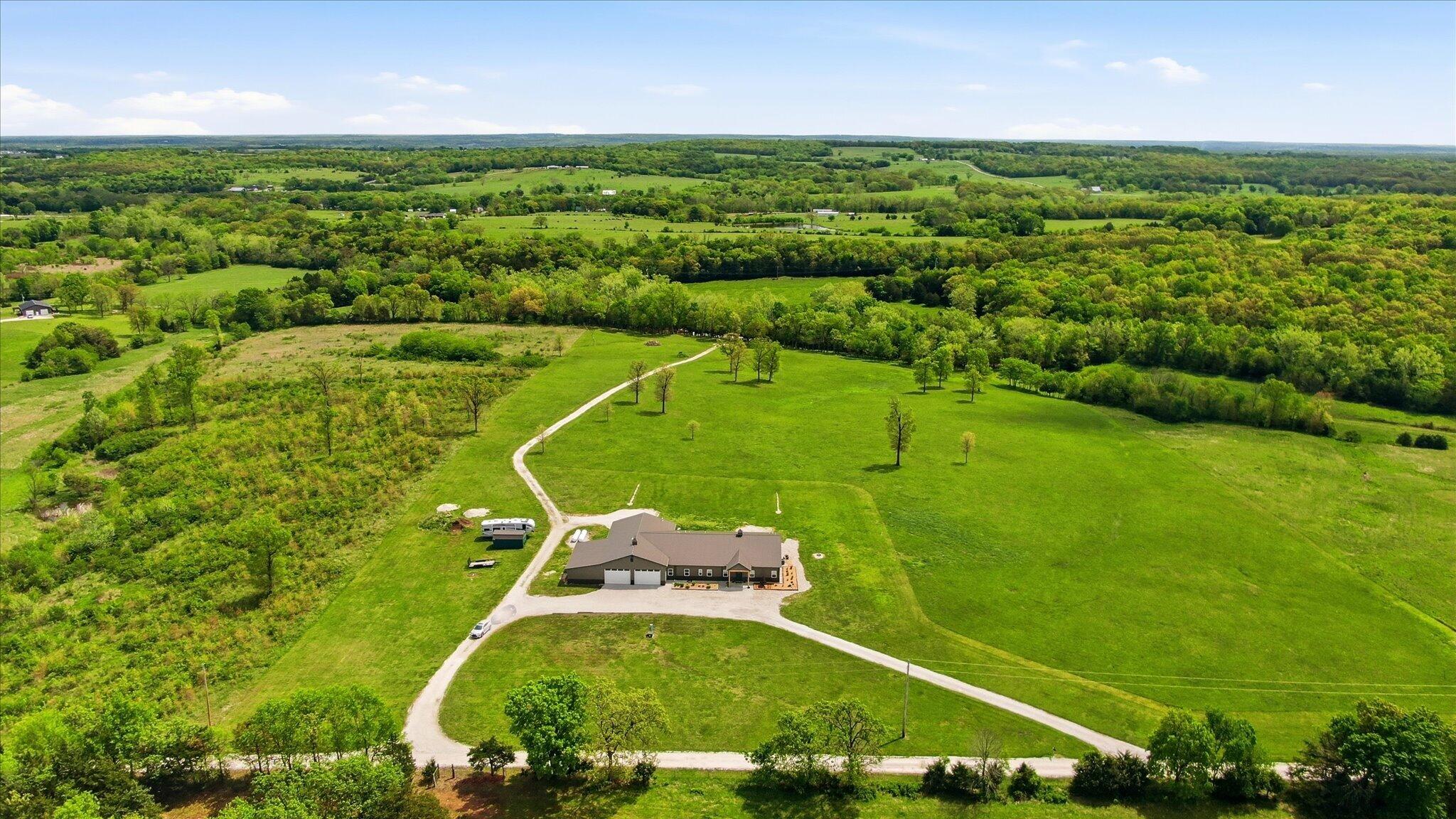 3870 South 75th Road Dunnegan, MO 65640 - Photo 1 of 58 69-DJI_0353