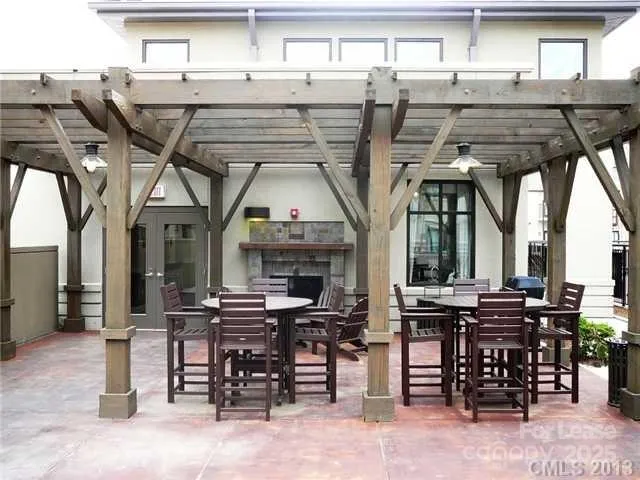 a view of a patio with table and chairs