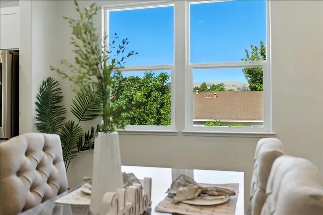 a kitchen with a sink stove and wooden floor