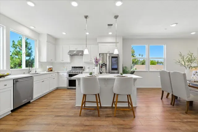 a kitchen with appliances and cabinets