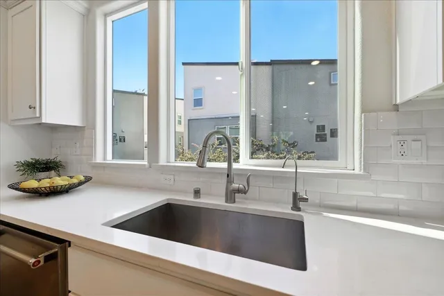 a kitchen with a sink stove and refrigerator