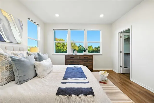 a bathroom with double sink and a mirror