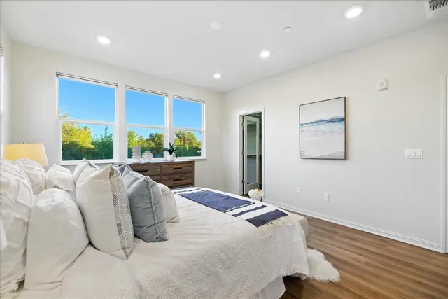 a bathroom with a double vanity sink mirror and shower