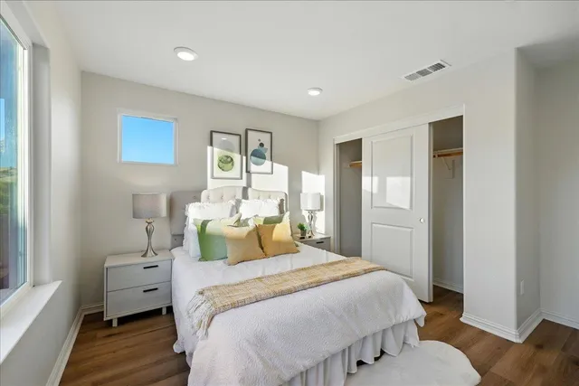 a bathroom with a sink a toilet and a large mirror