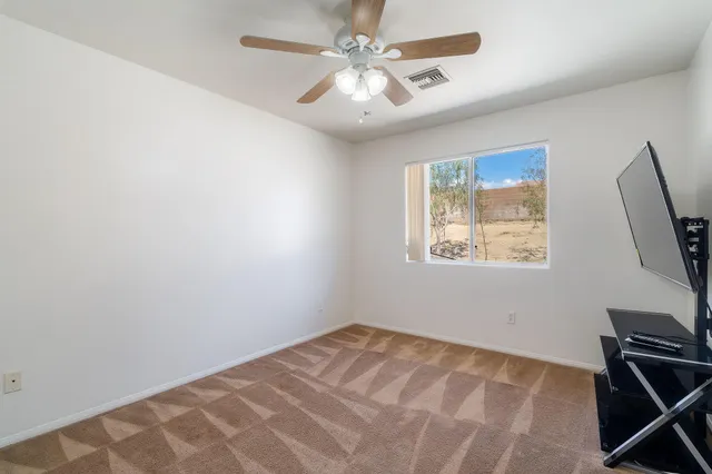 a view of a livingroom with a flat screen tv