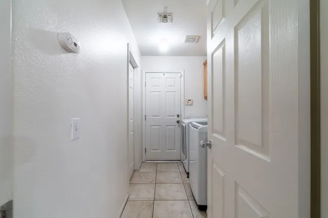 a bathroom with a granite countertop sink and shower