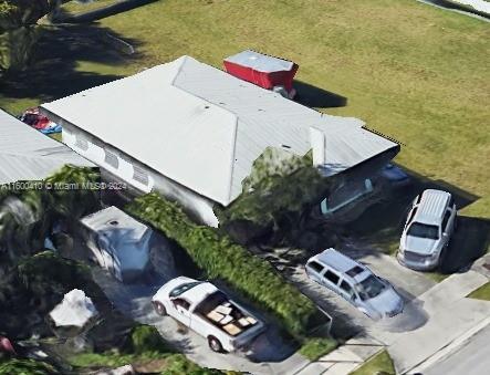 10362 Southwest 180th Street Miami, FL 33157 - Photo 1 of 7 a aerial view of a house with a garden