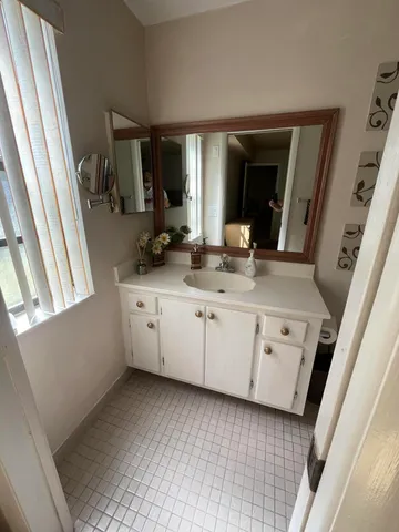 a bathroom with a toilet sink and shower