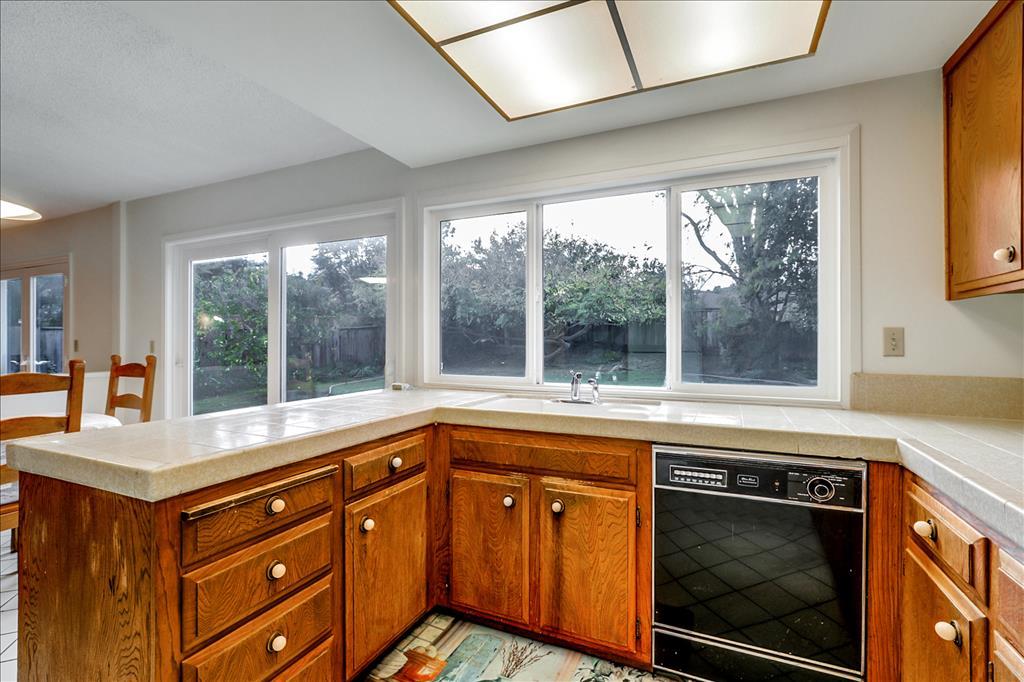 11351 Bubb Road Cupertino, CA 95014 - Photo 14 of 14 a kitchen with a sink and large window