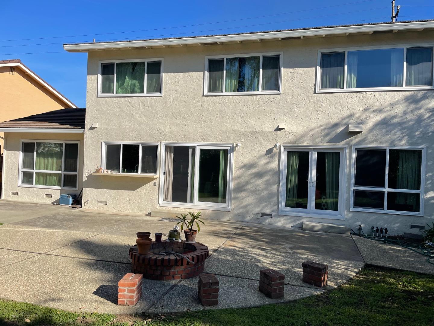 11351 Bubb Road Cupertino, CA 95014 - Photo 8 of 14 a front view of a house with a yard
