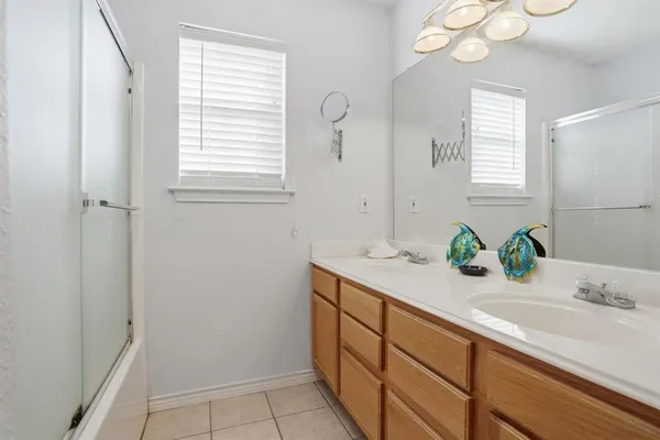 a bathroom with a sink a vanity and a mirror