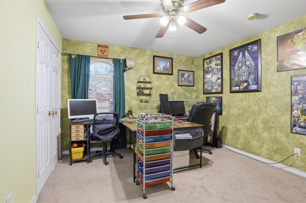 921 Calder Street Howe, TX 75459 - Photo 18 of 25 a living room with furniture and a baby crib