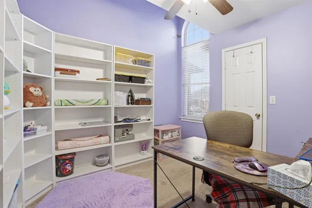 a workspace with furniture and window