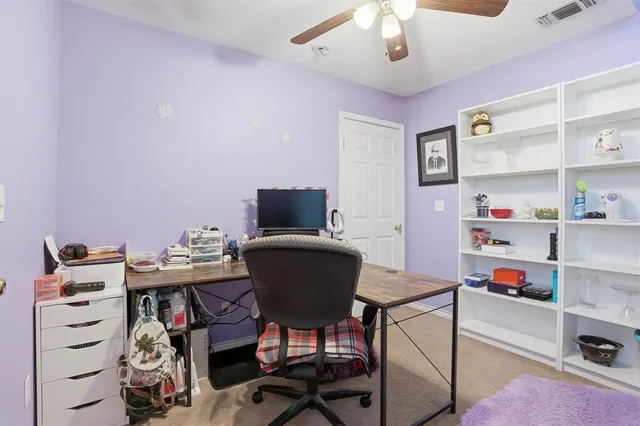 a view of a workspace with furniture