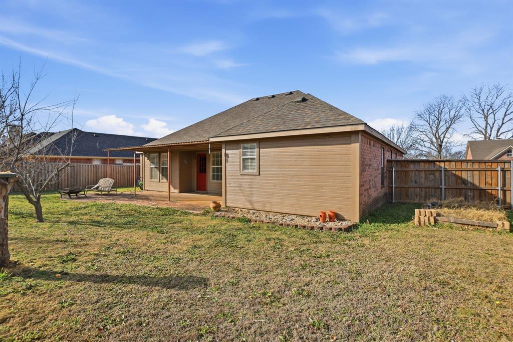 921 Calder Street Howe, TX 75459 - Photo 22 of 25 a front view of a house with garden