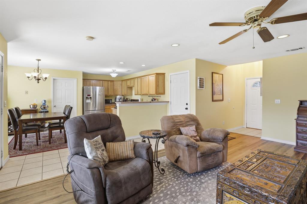 921 Calder Street Howe, TX 75459 - Photo 7 of 25 a living room with furniture and a view of kitchen