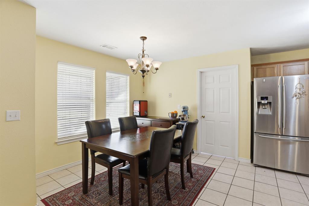 921 Calder Street Howe, TX 75459 - Photo 9 of 25 a view of a dining room with a table and chairs