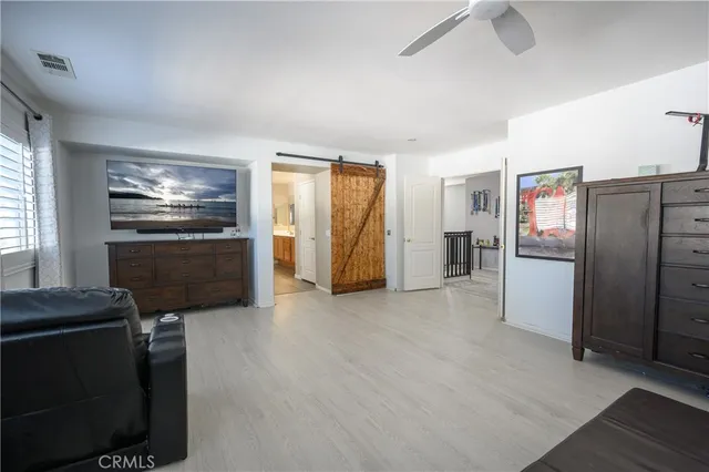 a kitchen with stainless steel appliances a refrigerator and a stove top oven