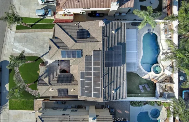 an aerial view of residential houses with outdoor space