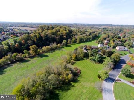 1339 Beaconfield Lane Lancaster, PA 17601 - Photo 5 of 9 an aerial view of green landscape with trees houses and mountain view