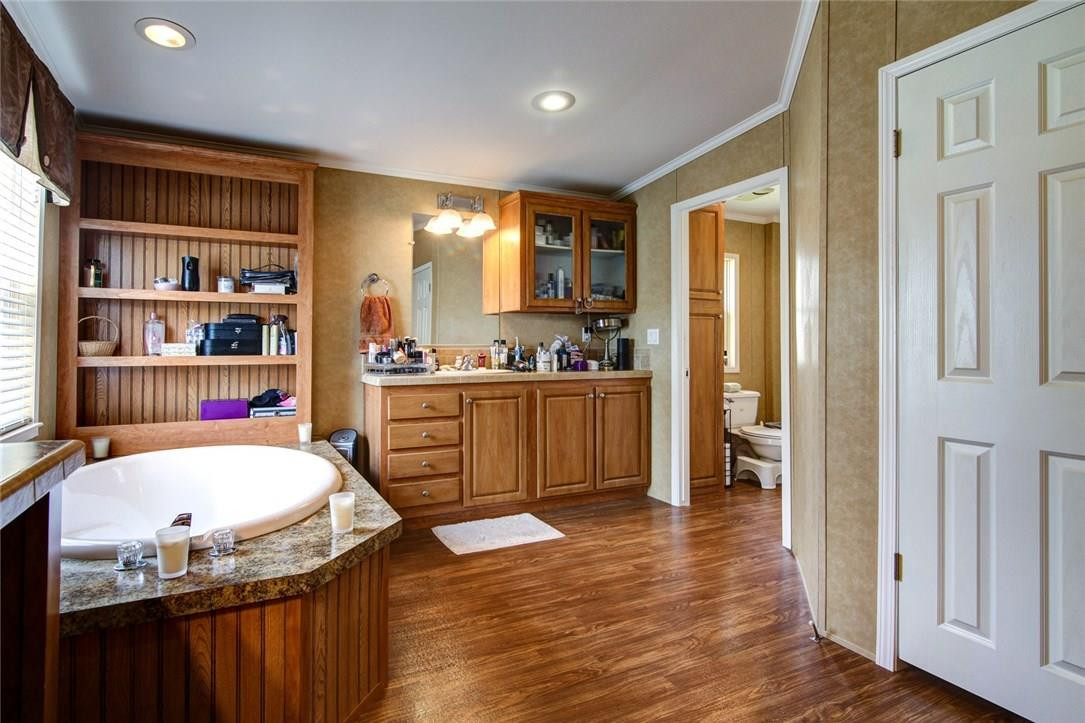 1600 Southwest 65th Avenue Boca Raton, FL 33428 - Photo 13 of 16 a room with a wooden floor and furniture