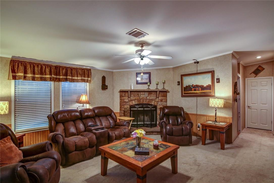 1600 Southwest 65th Avenue Boca Raton, FL 33428 - Photo 3 of 16 a living room with furniture a fireplace and a large window