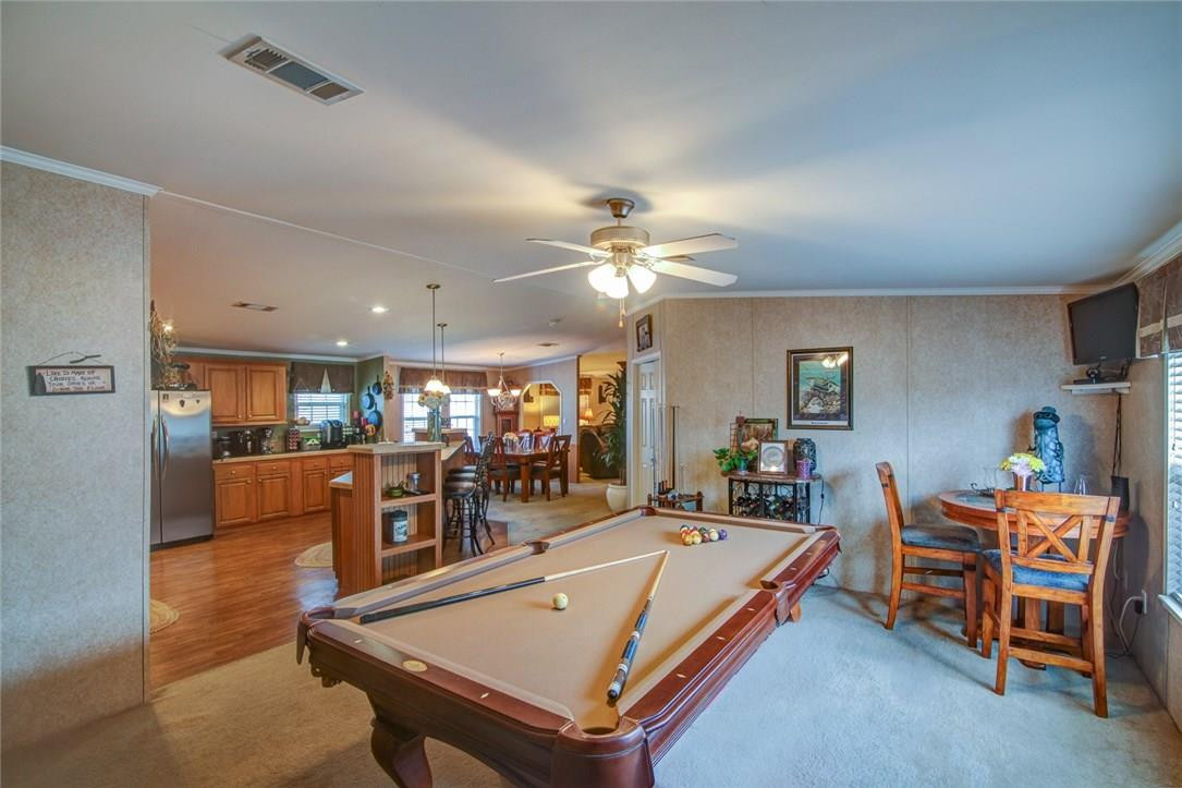 1600 Southwest 65th Avenue Boca Raton, FL 33428 - Photo 5 of 16 a living room with furniture a chandelier and a dining table