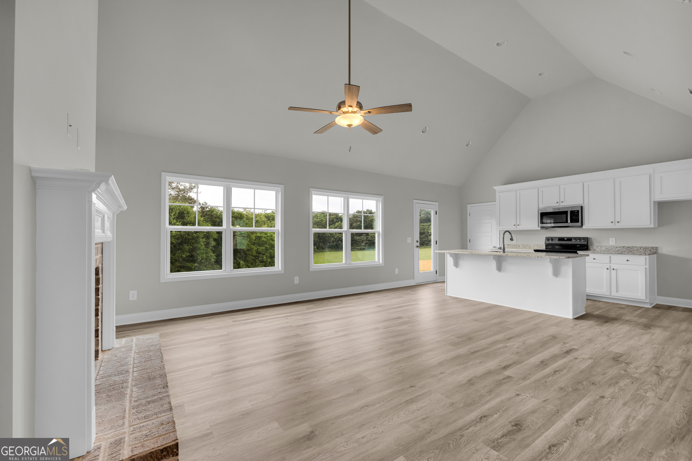 110 Sewell Road Lavonia, GA 30553 - Photo 27 of 73 a view of an empty room with kitchen and window