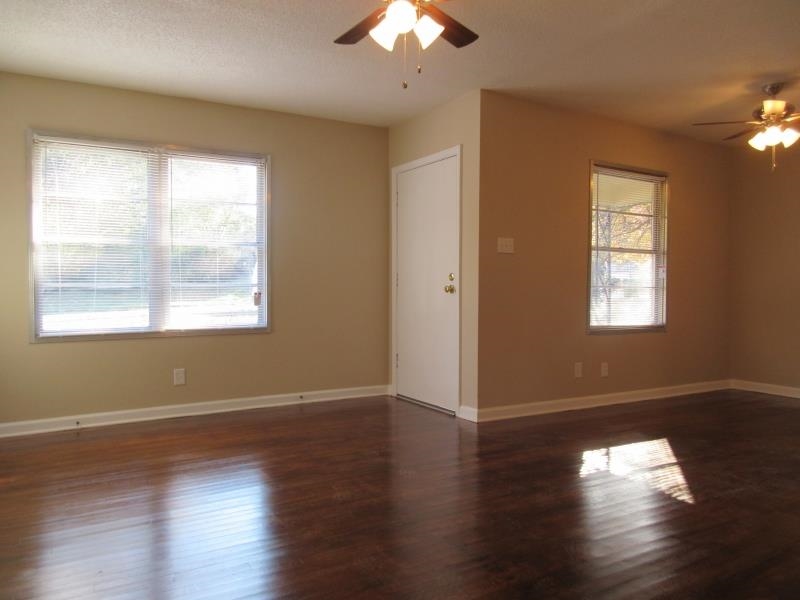3379 Ridgecrest Street Memphis, TN 38127 - Photo 8 of 8 Unfurnished room with wood finished floors, a ceiling fan, and baseboards