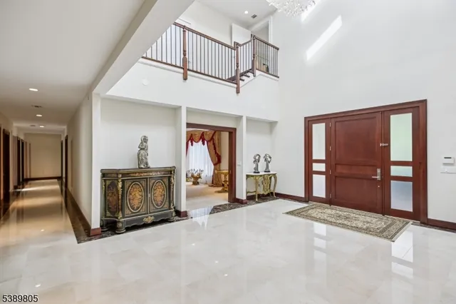 a view of a livingroom with a fireplace cabinet and a rug