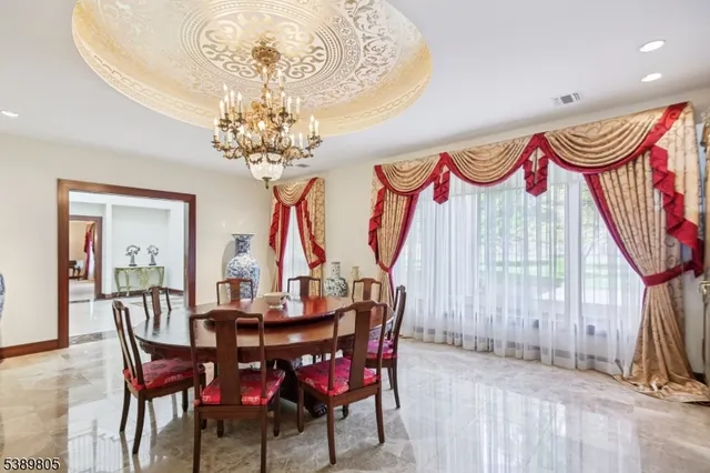 a view of a room with gym equipment and a large window