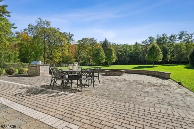 a view of a chairs and table on the patio