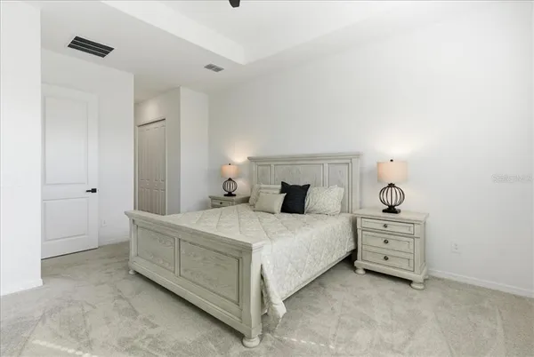 a bedroom with a bed and a cabinets