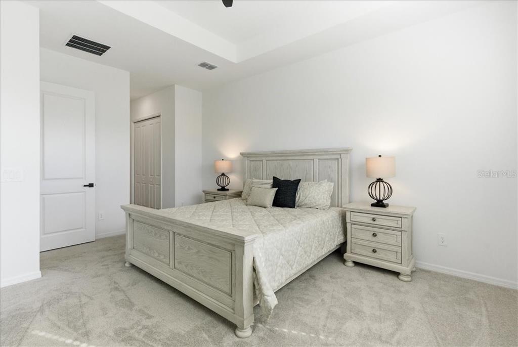 19168 Cherrystone Way Lakewood Ranch, FL 34211 - Photo 15 of 23 a bedroom with a bed and a cabinets