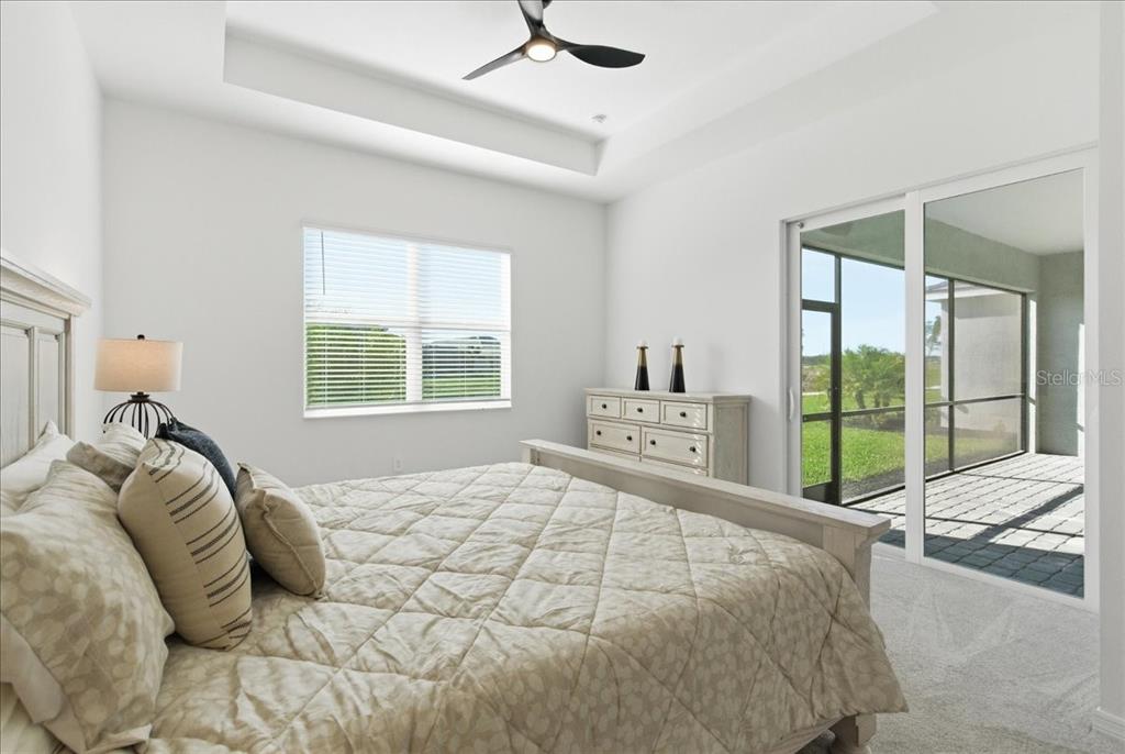 19168 Cherrystone Way Lakewood Ranch, FL 34211 - Photo 16 of 23 a bedroom with a bed and a large window