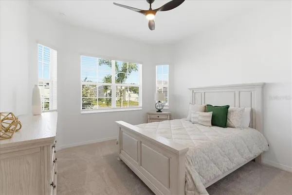 a bedroom with a bed and window