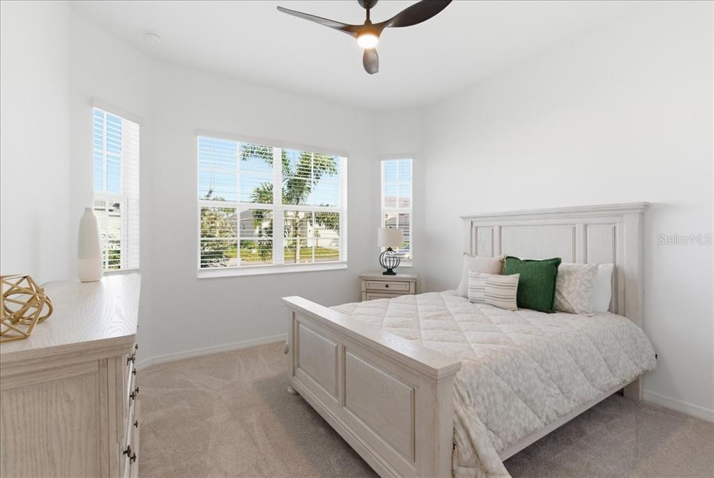 19168 Cherrystone Way Lakewood Ranch, FL 34211 - Photo 10 of 23 a bedroom with a bed and window
