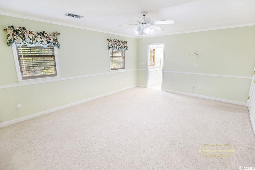 539 Old Field Road Murrells Inlet, SC 29576 - Photo 24 of 39 Carpeted spare room with crown molding, ceiling fa