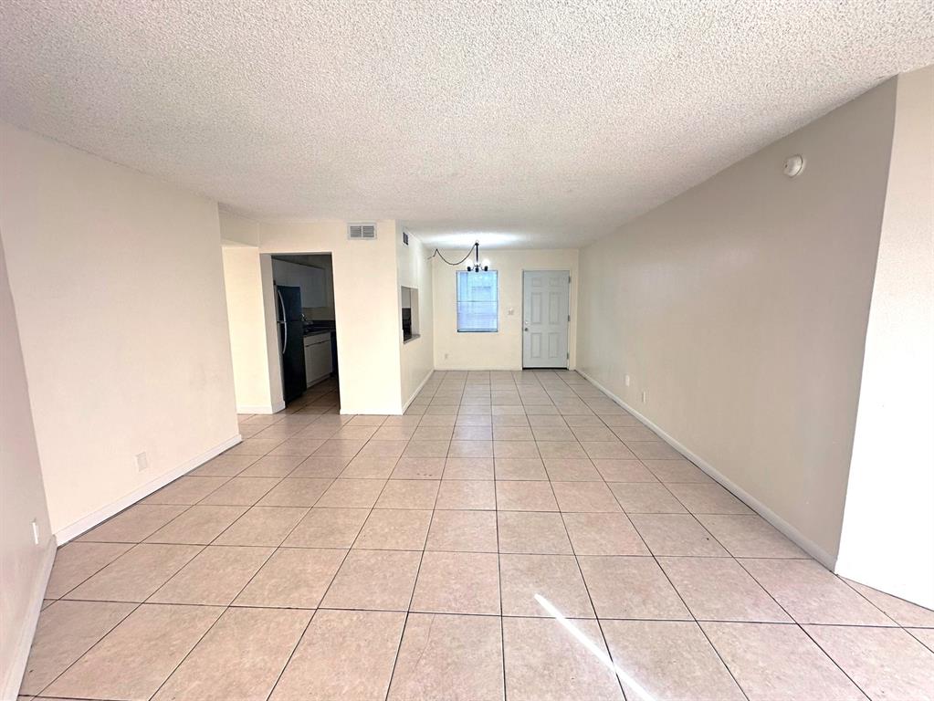 1850 North Congress Avenue, Unit 208 West Palm Beach, FL 33401 - Photo 5 of 15 a view of an empty room with a window