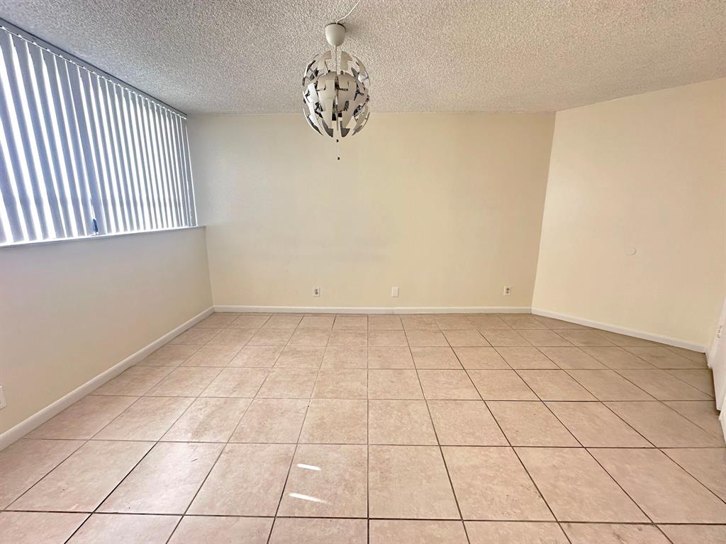 1850 North Congress Avenue, Unit 208 West Palm Beach, FL 33401 - Photo 6 of 15 a view of an empty room and a window