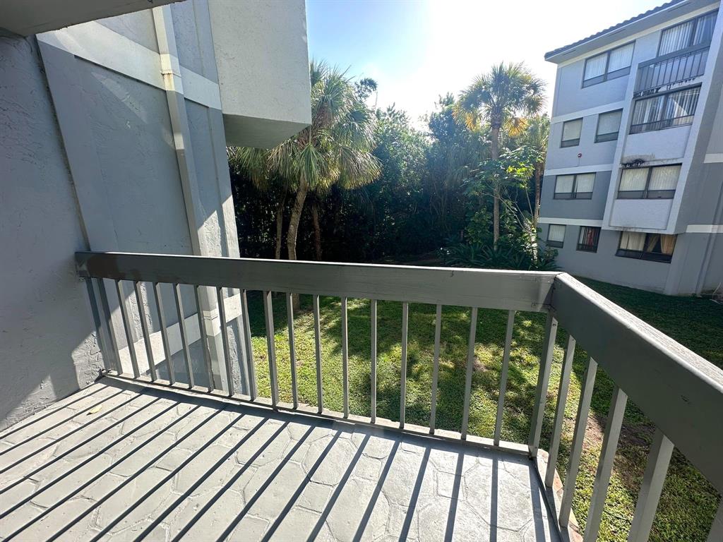 1850 North Congress Avenue, Unit 208 West Palm Beach, FL 33401 - Photo 9 of 15 a view of balcony with wooden floor