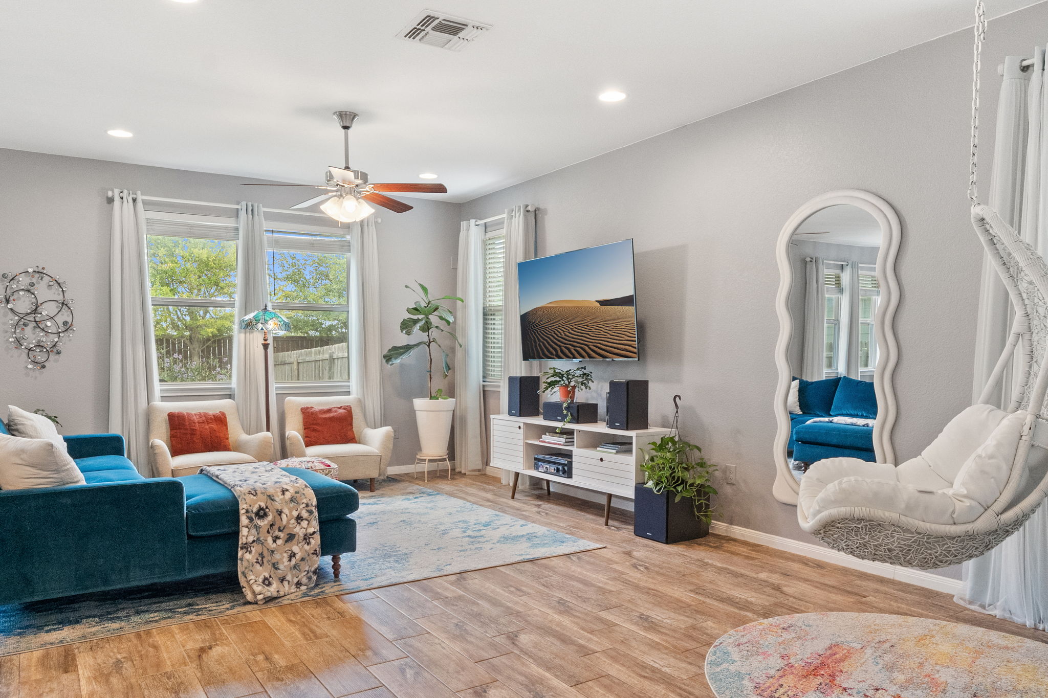 1306 Falconer Way Austin, TX 78748 - Photo 11 of 39 a living room with furniture and a flat screen tv