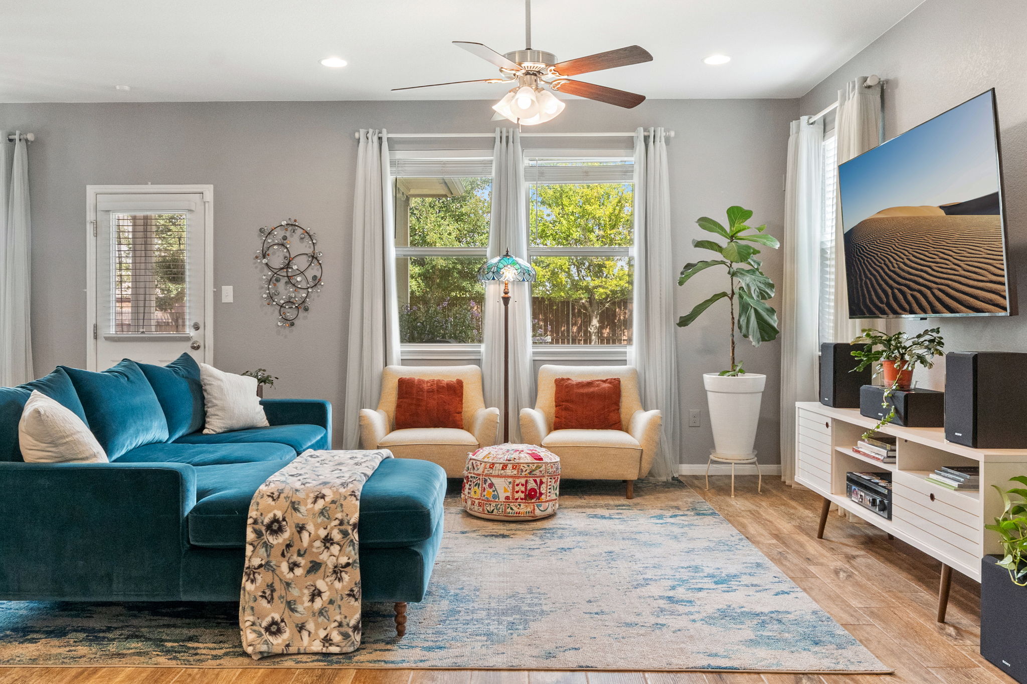 1306 Falconer Way Austin, TX 78748 - Photo 12 of 39 a living room with furniture and a large window