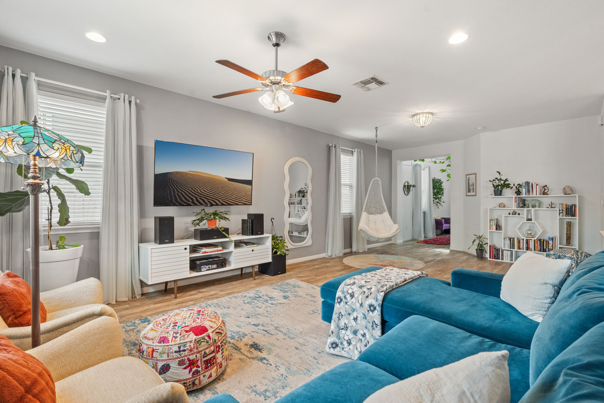 1306 Falconer Way Austin, TX 78748 - Photo 13 of 39 a living room with furniture and a flat screen tv